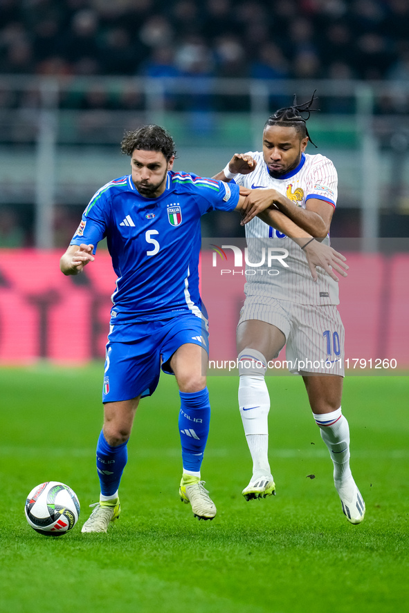 Manuel Locatelli of Italy and Christopher Nkunku of France compete for the ball during the UEFA Nations League 2024/25 League A Group 2 matc...