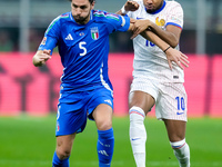 Manuel Locatelli of Italy and Christopher Nkunku of France compete for the ball during the UEFA Nations League 2024/25 League A Group 2 matc...