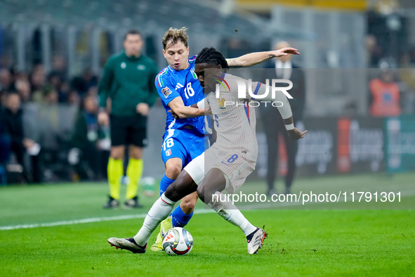 Nicolo' Barella of Italy and Manu Kone' of France compete for the ball during the UEFA Nations League 2024/25 League A Group 2 match between...