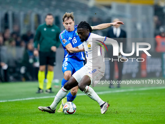 Nicolo' Barella of Italy and Manu Kone' of France compete for the ball during the UEFA Nations League 2024/25 League A Group 2 match between...