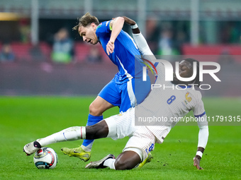 Nicolo' Barella of Italy and Manu Kone' of France compete for the ball during the UEFA Nations League 2024/25 League A Group 2 match between...