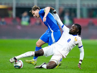 Nicolo' Barella of Italy and Manu Kone' of France compete for the ball during the UEFA Nations League 2024/25 League A Group 2 match between...