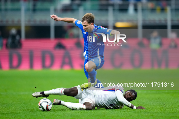 Nicolo' Barella of Italy and Manu Kone' of France compete for the ball during the UEFA Nations League 2024/25 League A Group 2 match between...