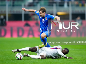 Nicolo' Barella of Italy and Manu Kone' of France compete for the ball during the UEFA Nations League 2024/25 League A Group 2 match between...