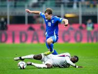 Nicolo' Barella of Italy and Manu Kone' of France compete for the ball during the UEFA Nations League 2024/25 League A Group 2 match between...