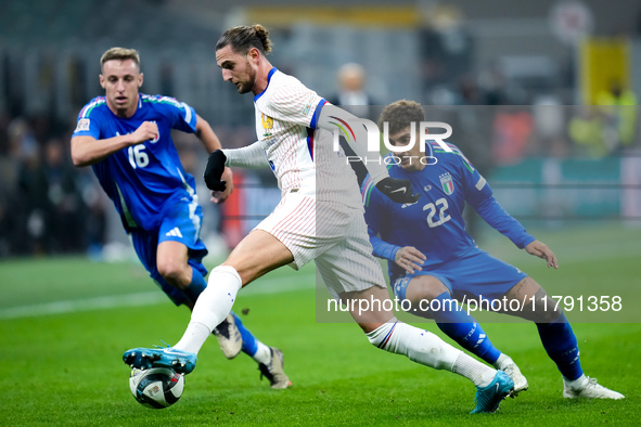 Adrien Rabiot of France is challenged by Davide Frattesi of Italy and Giovanni Di Lorenzo during the UEFA Nations League 2024/25 League A Gr...