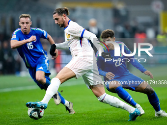 Adrien Rabiot of France is challenged by Davide Frattesi of Italy and Giovanni Di Lorenzo during the UEFA Nations League 2024/25 League A Gr...