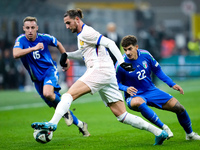 Adrien Rabiot of France is challenged by Davide Frattesi of Italy and Giovanni Di Lorenzo during the UEFA Nations League 2024/25 League A Gr...