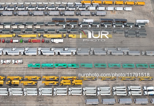 A large number of trucks and construction machinery gather at Yantai Port waiting for shipment for export in China's Shandong province, on N...