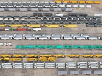 A large number of trucks and construction machinery gather at Yantai Port waiting for shipment for export in China's Shandong province, on N...