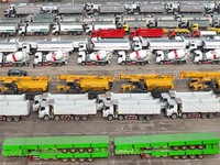 A large number of trucks and construction machinery gather at Yantai Port waiting for shipment for export in China's Shandong province, on N...