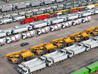 A large number of trucks and construction machinery gather at Yantai Port waiting for shipment for export in China's Shandong province, on N...