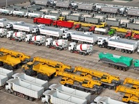 A large number of trucks and construction machinery gather at Yantai Port waiting for shipment for export in China's Shandong province, on N...