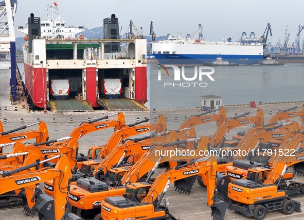 A large number of construction machines gather at Yantai Port, waiting for shipment for export in Yantai, China, on November 19, 2024. 