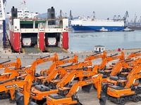 A large number of construction machines gather at Yantai Port, waiting for shipment for export in Yantai, China, on November 19, 2024. (