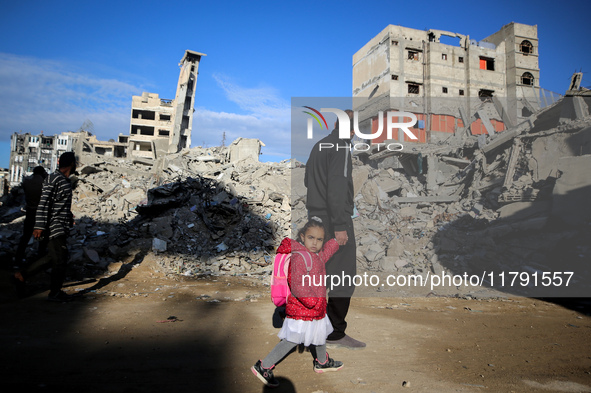 A Palestinian walks next to the rubble of a house destroyed in previous airstrikes during the Israeli military offensive, amid the ongoing c...