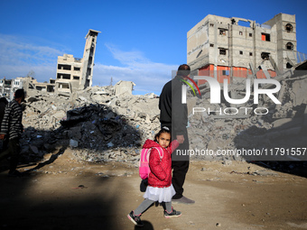 A Palestinian walks next to the rubble of a house destroyed in previous airstrikes during the Israeli military offensive, amid the ongoing c...