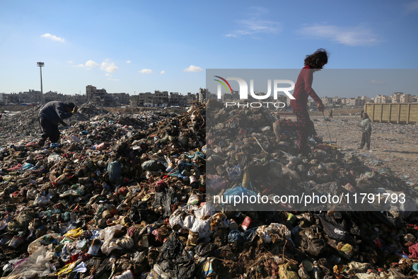 A Palestinian searches through a pile of garbage in Khan Yunis, Gaza Strip, on November 19, 2024, amid the ongoing war between Israel and th...