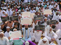 Indian Muslims shout slogans during a protest against the Anti-Waqf Amendment Bill in Kolkata, India, on November 19, 2024. More than 60 tho...