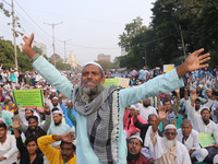 Indian Muslims shout slogans during a protest against the Anti-Waqf Amendment Bill in Kolkata, India, on November 19, 2024. More than 60 tho...