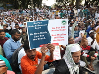 Activists of The All India Youth Federation (AIYF) take part in a protest meeting in Kolkata, India, on November 19, 2024, demanding the wit...