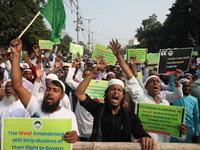 Activists of The All India Youth Federation (AIYF) take part in a protest meeting in Kolkata, India, on November 19, 2024, demanding the wit...