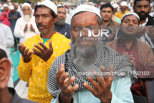 Activists of The All India Youth Federation (AIYF) offer prayers during a protest meeting in Kolkata, India, on November 19, 2024, demanding...