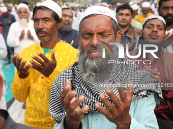 Activists of The All India Youth Federation (AIYF) offer prayers during a protest meeting in Kolkata, India, on November 19, 2024, demanding...