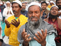 Activists of The All India Youth Federation (AIYF) offer prayers during a protest meeting in Kolkata, India, on November 19, 2024, demanding...