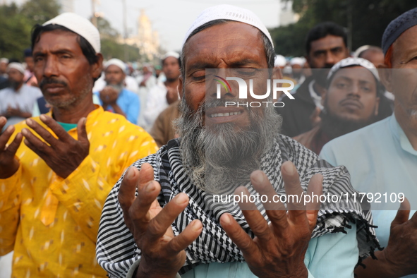 Activists of The All India Youth Federation (AIYF) offer prayers during a protest meeting in Kolkata, India, on November 19, 2024, demanding...