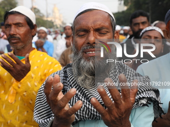 Activists of The All India Youth Federation (AIYF) offer prayers during a protest meeting in Kolkata, India, on November 19, 2024, demanding...