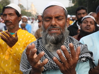 Activists of The All India Youth Federation (AIYF) offer prayers during a protest meeting in Kolkata, India, on November 19, 2024, demanding...