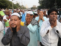 Activists of The All India Youth Federation (AIYF) offer prayers during a protest meeting in Kolkata, India, on November 19, 2024, demanding...