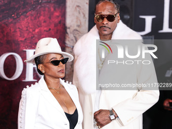 Shante Broadus and husband Snoop Dogg (Calvin Broadus Jr.) arrive at the Los Angeles Premiere Of Paramount Pictures' 'Gladiator II' held at...