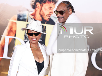 Shante Broadus and husband Snoop Dogg (Calvin Broadus Jr.) arrive at the Los Angeles Premiere Of Paramount Pictures' 'Gladiator II' held at...