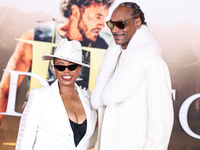 Shante Broadus and husband Snoop Dogg (Calvin Broadus Jr.) arrive at the Los Angeles Premiere Of Paramount Pictures' 'Gladiator II' held at...