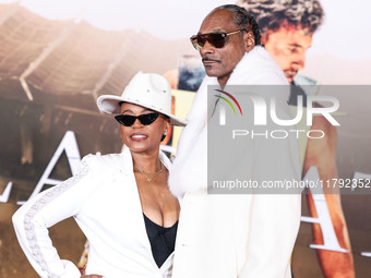 Shante Broadus and husband Snoop Dogg (Calvin Broadus Jr.) arrive at the Los Angeles Premiere Of Paramount Pictures' 'Gladiator II' held at...