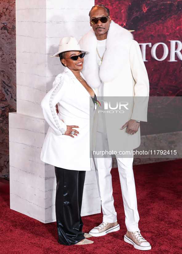 Shante Broadus and husband Snoop Dogg (Calvin Broadus Jr.) arrive at the Los Angeles Premiere Of Paramount Pictures' 'Gladiator II' held at...