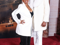 Shante Broadus and husband Snoop Dogg (Calvin Broadus Jr.) arrive at the Los Angeles Premiere Of Paramount Pictures' 'Gladiator II' held at...