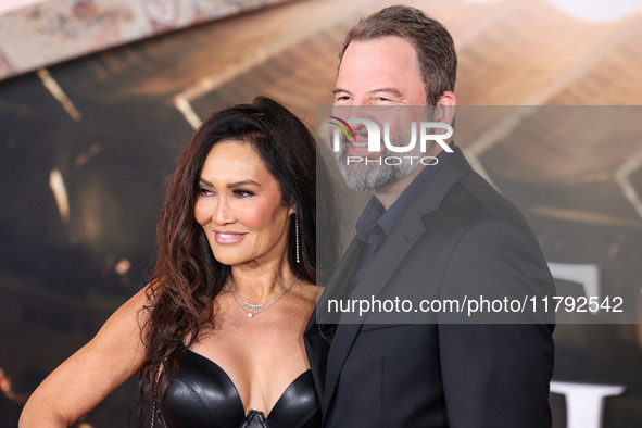 Tia Carrere and boyfriend Paul Debevec arrive at the Los Angeles Premiere Of Paramount Pictures' 'Gladiator II' held at the TCL Chinese Thea...