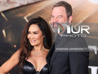 Tia Carrere and boyfriend Paul Debevec arrive at the Los Angeles Premiere Of Paramount Pictures' 'Gladiator II' held at the TCL Chinese Thea...