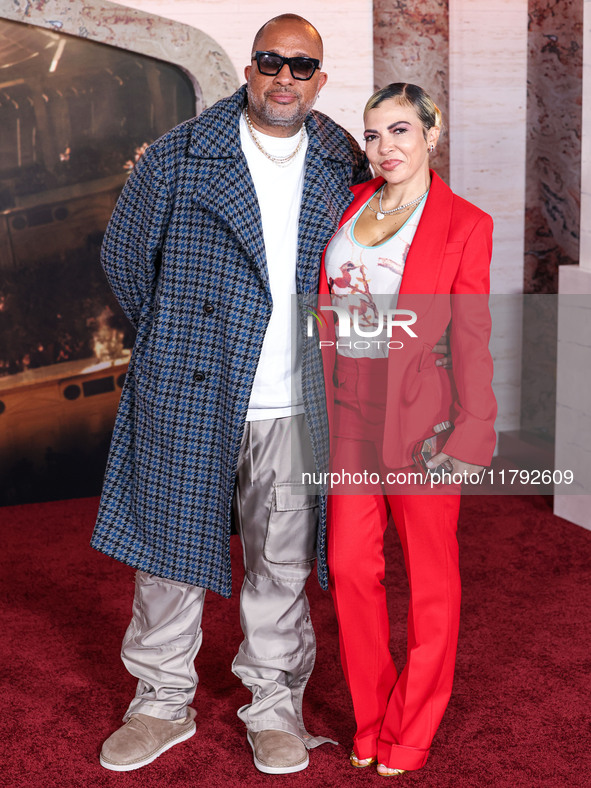 Kenya Barris and Rainbow Edwards-Barris arrive at the Los Angeles Premiere Of Paramount Pictures' 'Gladiator II' held at the TCL Chinese The...