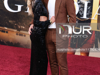 Hannah Godwin and husband Dylan Barbour arrive at the Los Angeles Premiere Of Paramount Pictures' 'Gladiator II' held at the TCL Chinese The...