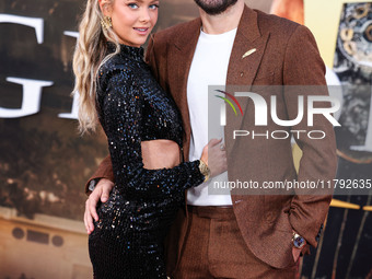 Hannah Godwin and husband Dylan Barbour arrive at the Los Angeles Premiere Of Paramount Pictures' 'Gladiator II' held at the TCL Chinese The...