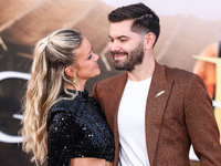 Hannah Godwin and husband Dylan Barbour arrive at the Los Angeles Premiere Of Paramount Pictures' 'Gladiator II' held at the TCL Chinese The...