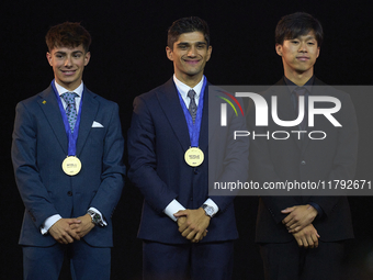 Ai Ogura (R) of Japan and Moto2 champion, Jorge Martin (C) of Spain and MotoGP Champion and David Alonso (L) of Colombia and Moto3 Champion...