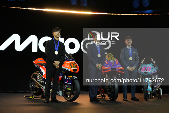 Ai Ogura (L) of Japan and Moto2 champion, Jorge Martin (89) of Spain and MotoGP Champion and David Alonso (80) of Colombia and Moto3 Champio...