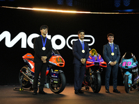 Ai Ogura (L) of Japan and Moto2 champion, Jorge Martin (89) of Spain and MotoGP Champion and David Alonso (80) of Colombia and Moto3 Champio...