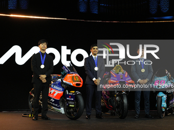 Ai Ogura (L) of Japan and Moto2 champion, Jorge Martin (89) of Spain and MotoGP Champion and David Alonso (80) of Colombia and Moto3 Champio...