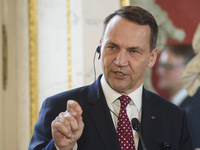 Polish Minister of Foreign Affairs Radoslaw Sikorski gestures as he addresses the media during the EU's Big Five press conference after talk...